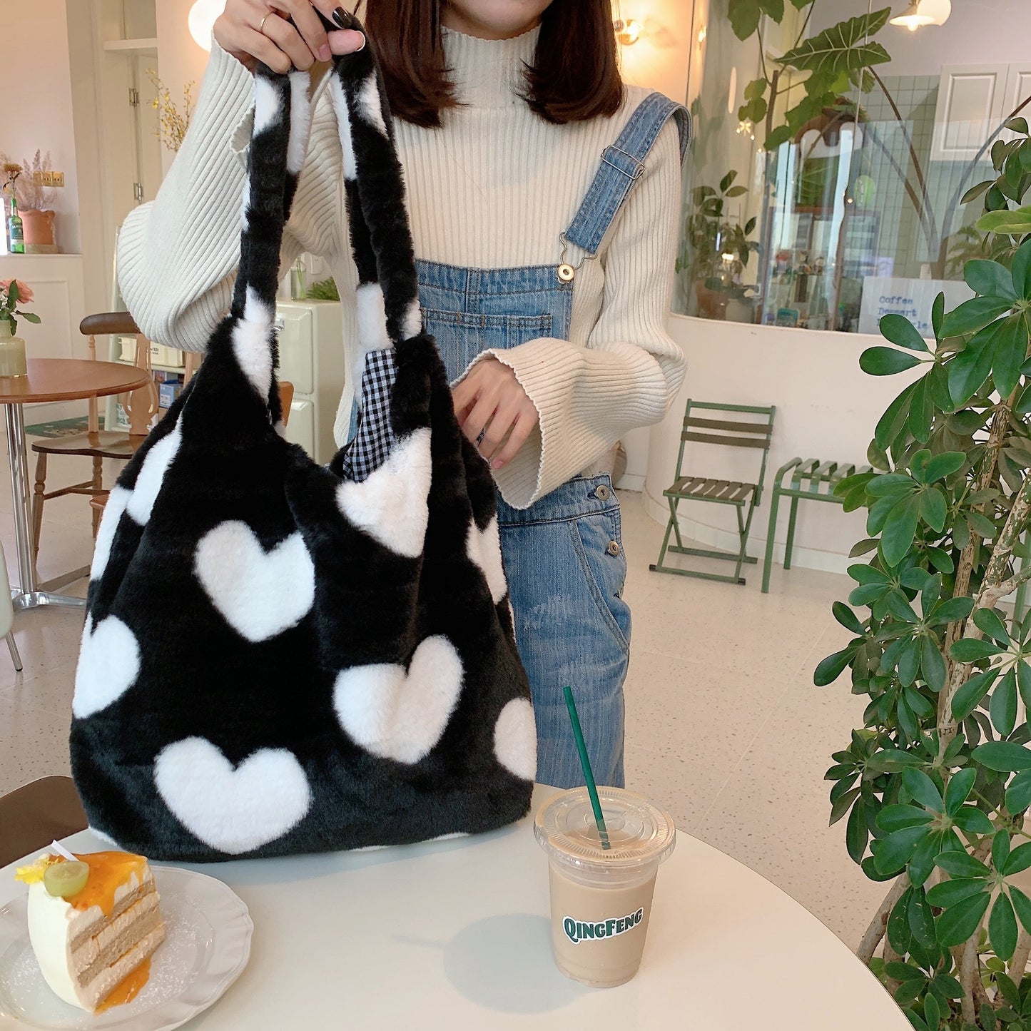 Love Hearts: Step Out in Style with Our Trendy Black and White Plush Hearts Purse