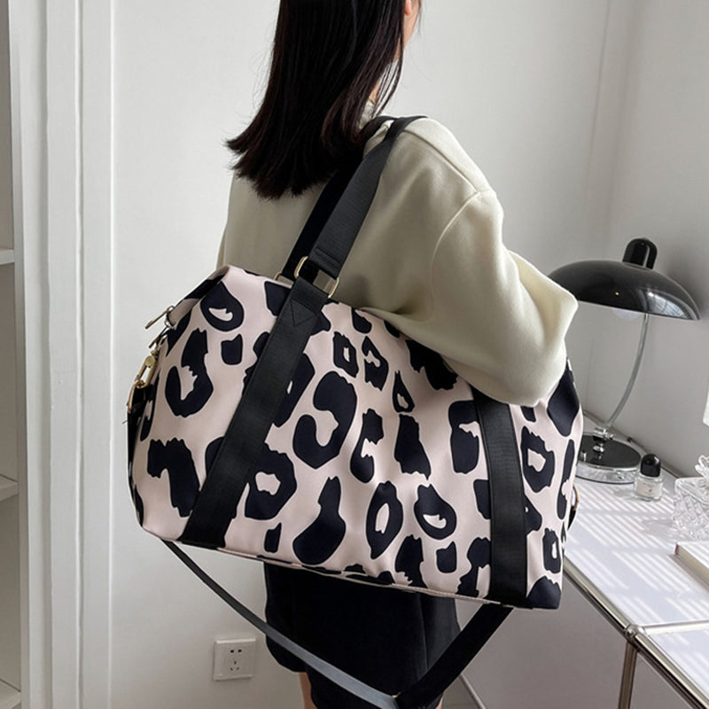 Moo-ve in Style: embrace the Bovine Chic with our Playful Cow Print Overnight Bag!