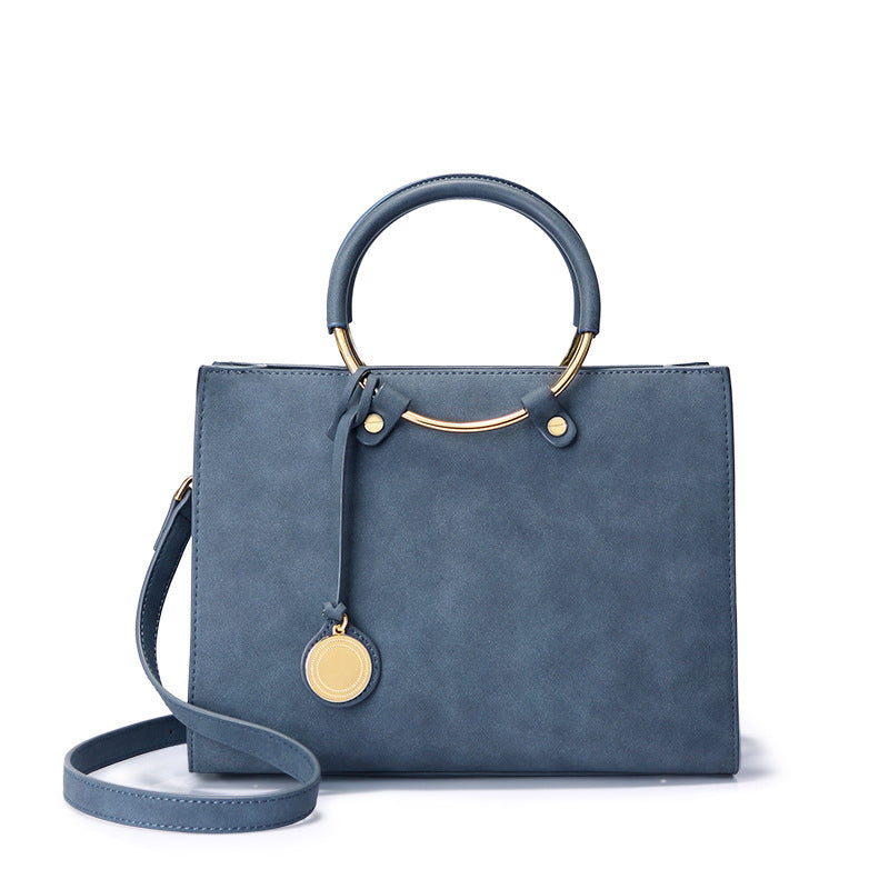 Timeless Elegance: Blue Leather Medium-sized Purse with Metal ring handles