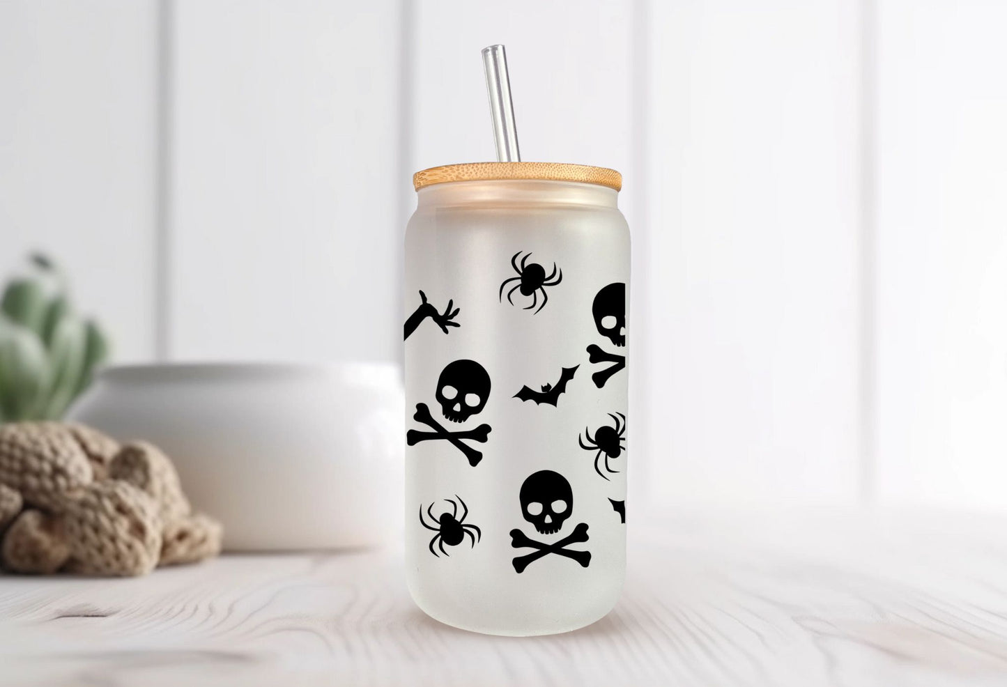 Enjoy your favorite beverage in our Dancing Skeletons Frosted 16 oz Libbey Style Glass with bamboo lid and straw